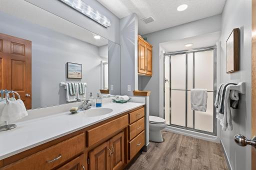 A well-appointed 3/4 bath offers convenience and privacy for guests while perfectly complementing the finished lower level.