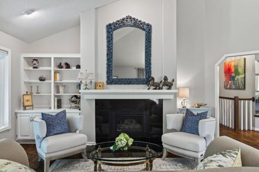 Rich architectural details, custom built-ins, and a gas fireplace create a sophisticated yet comfortable gathering space.