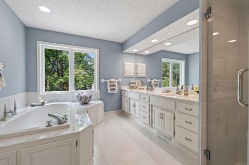 Private owner's suite bath with thoughtful updates and timeless finishes.