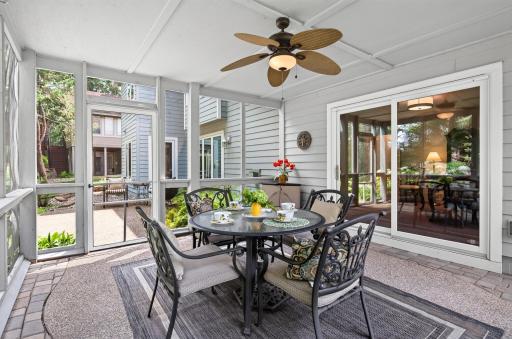 Enjoy the sights and sounds of the backyard waterfall from the comfort of the screened porch.