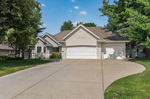Oversized three-car garage with updated MyQ smart openers and abundant storage.