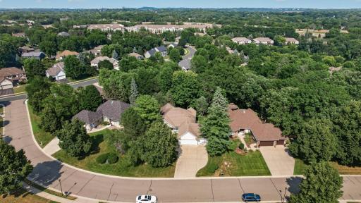 Beautifully positioned on one of the community's larger lots, offering exceptional privacy, professionally designed landscaping, and a peaceful natural setting.