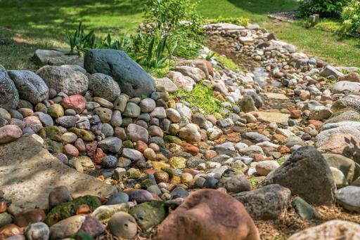 The soothing sounds of the backyard waterfall create a peaceful escape you'll enjoy from morning coffee to evening sunsets.