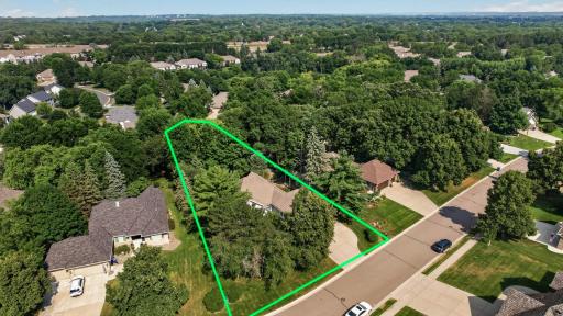 Beautifully positioned on one of the community's larger lots, offering exceptional privacy, professionally designed landscaping, and a peaceful natural setting.