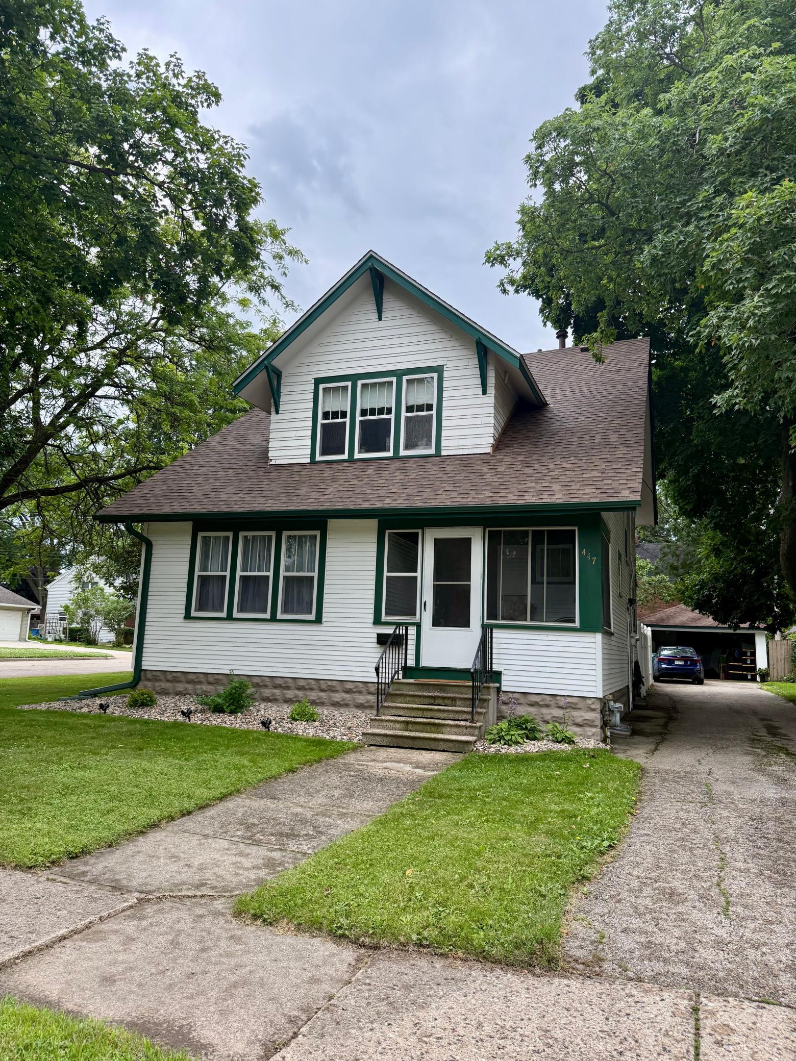 Charming curb appeal and a detached 2 car garage tucked around back