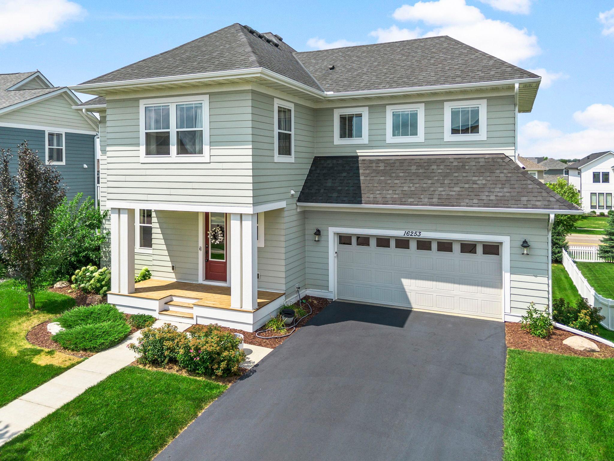 2020 build with charming front porch and curb appeal