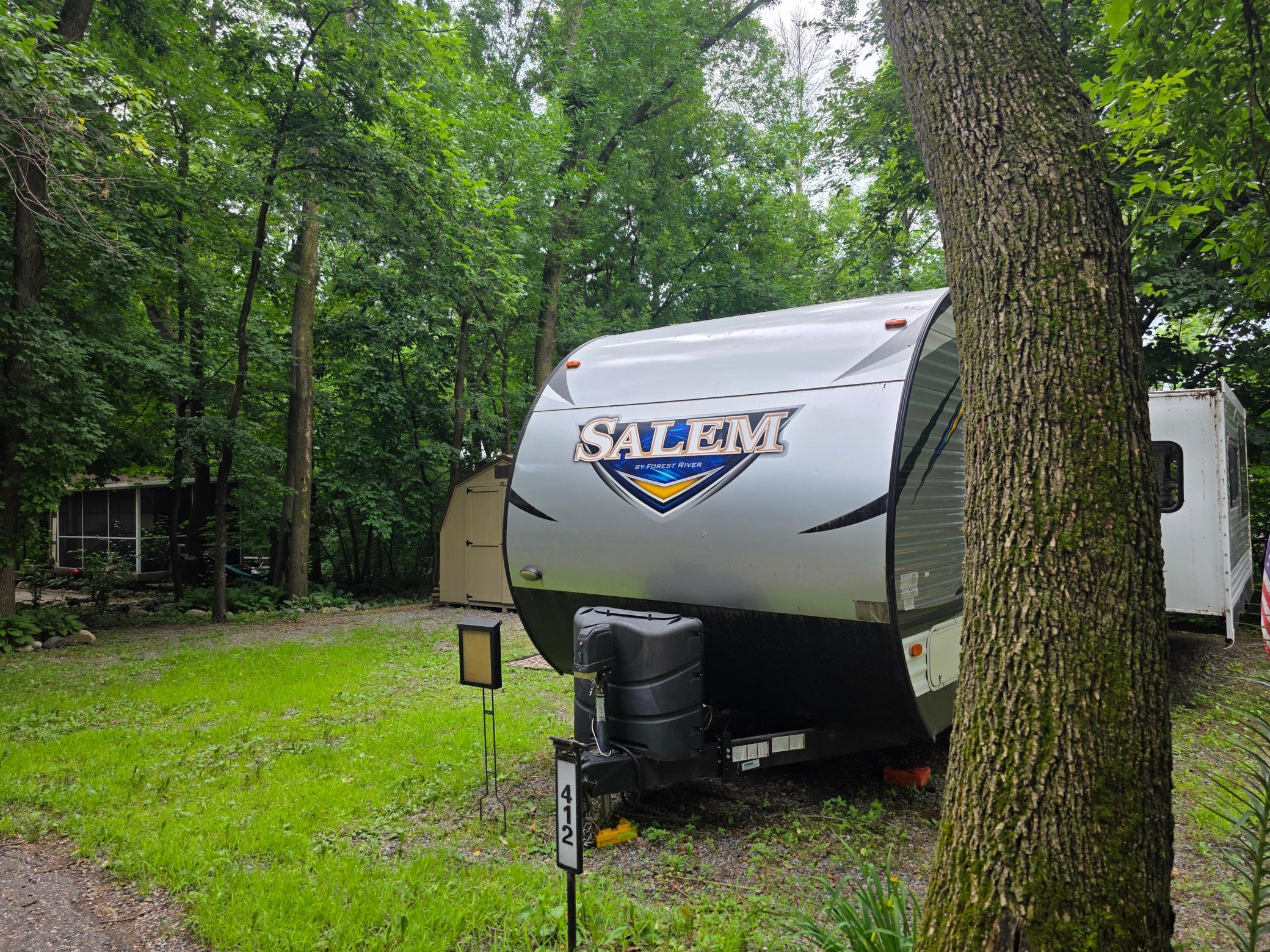 Unit 412 of Cokato Lake RV Resort is a fairly private "lot" with a nice shed, well landscaped. RV and "lot" may be sold separately and if RV is sold first, it will be removed and "lot" sold separately.