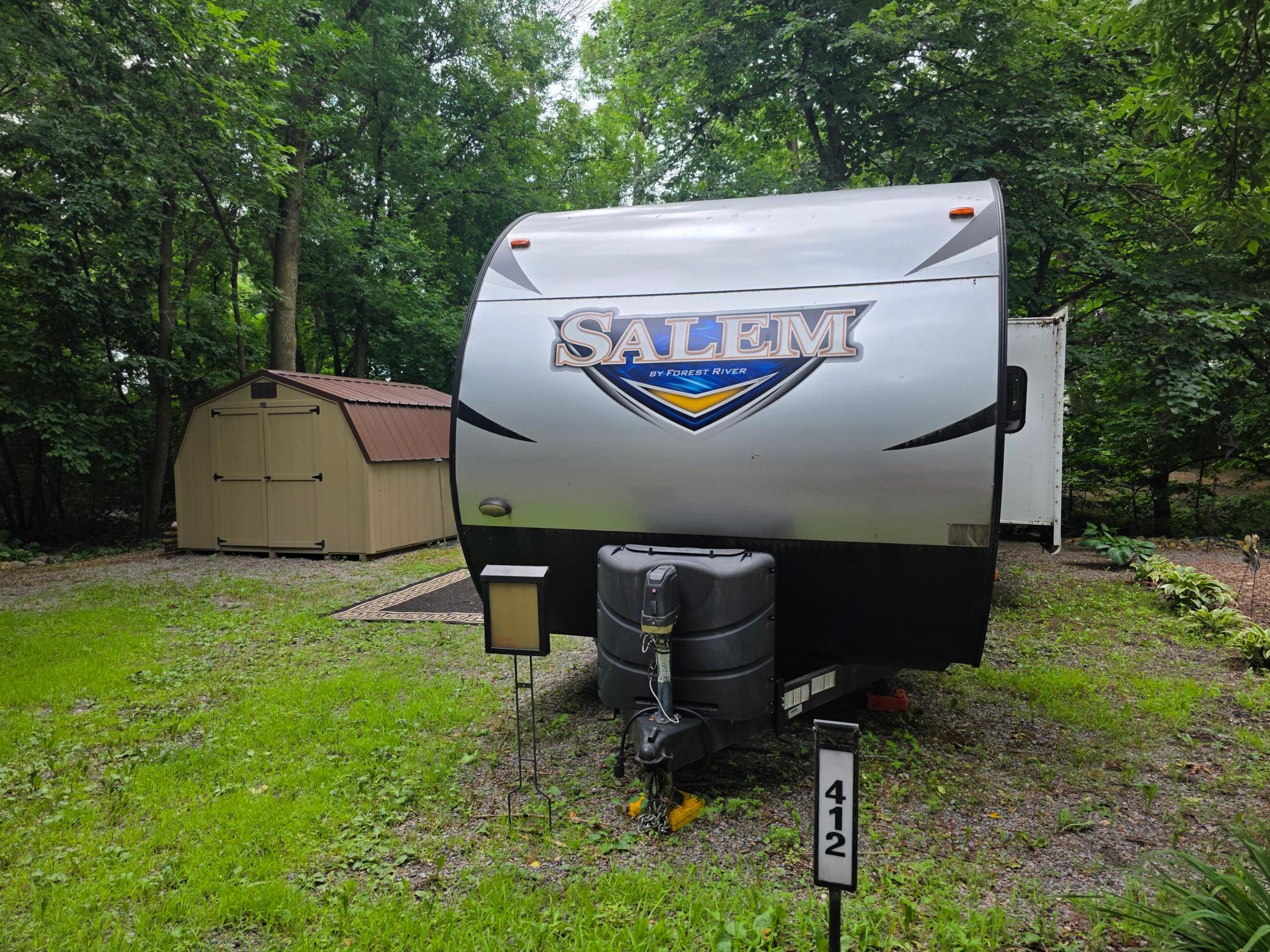 Unit 412 of Cokato Lake RV Resort is a fairly private "lot" with a nice shed, well landscaped. RV and "lot" may be sold separately and if RV is sold first, it will be removed and "lot" sold separately.