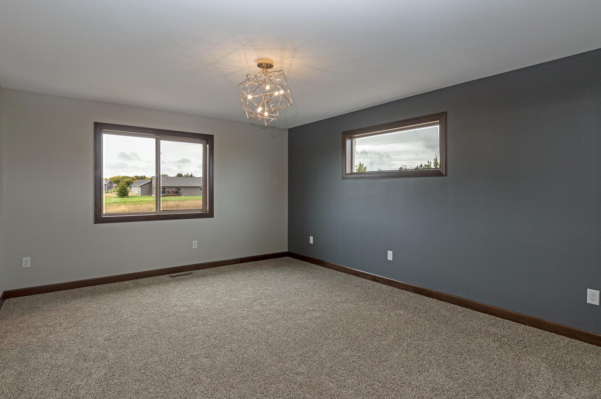 Primary ensuite w/ large walk-in closet and private bath