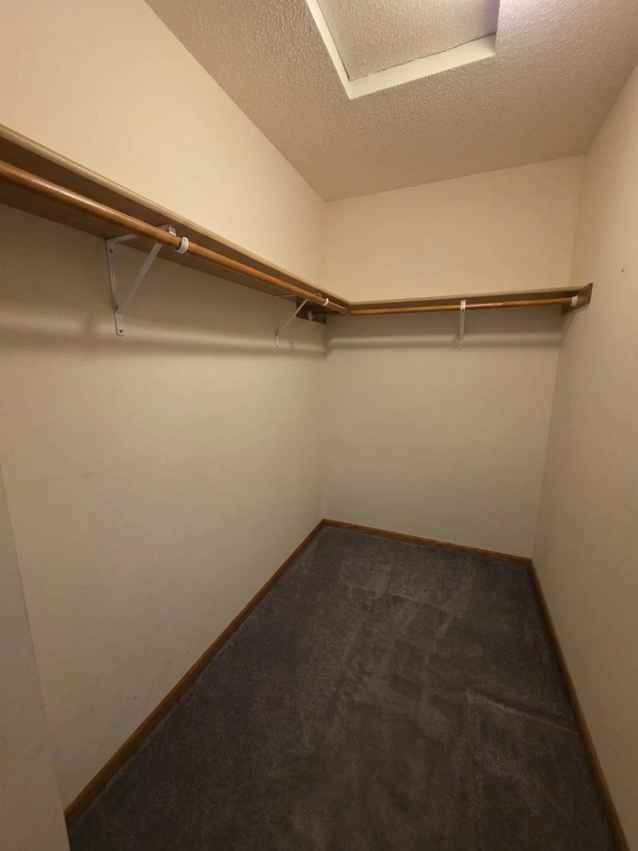 Generous walk-in closet offering excellent storage and organization potential.