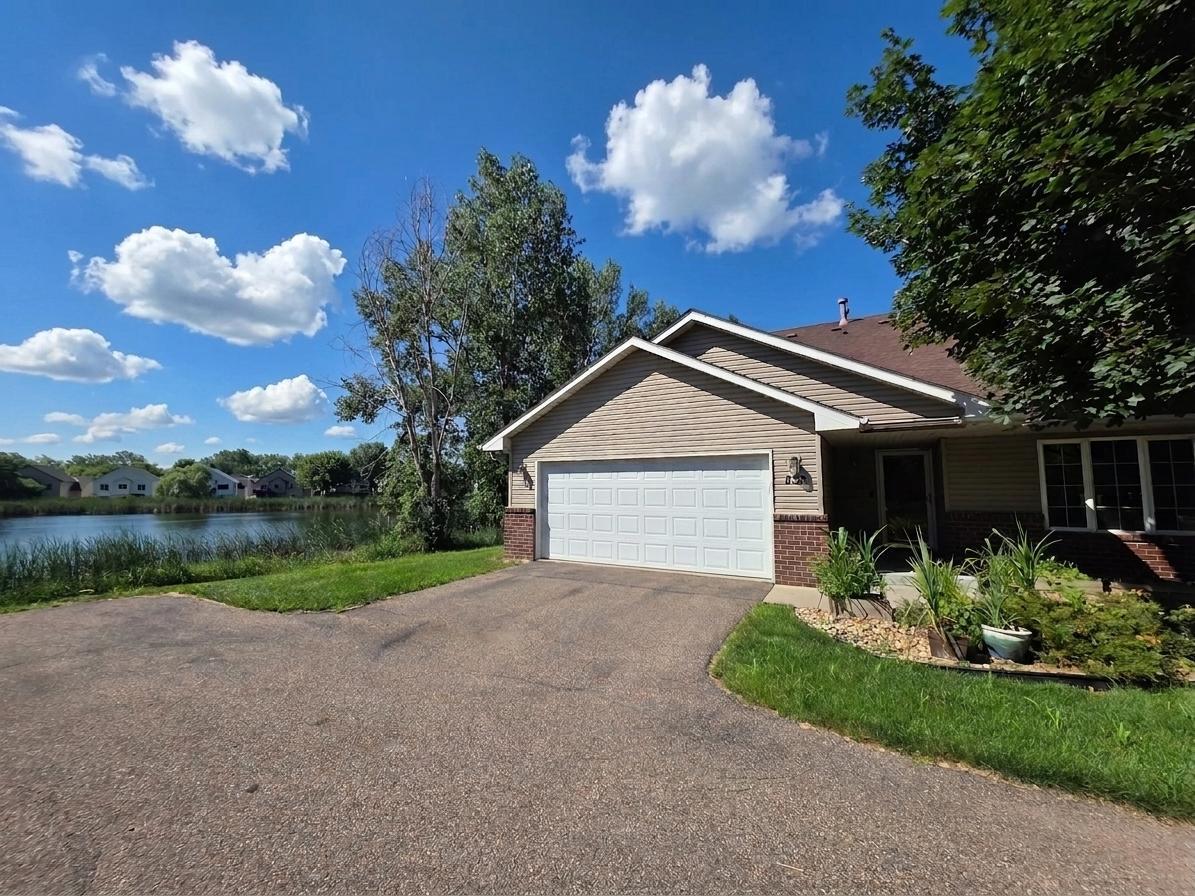 Welcome to 832 Matthew Drive! Private end-unit setting with an attached two-car garage and scenic pond views.