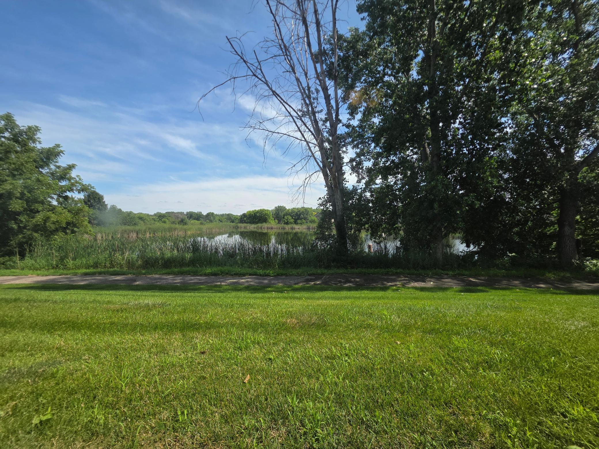 Beautiful pond setting just outside the home, with mature trees and nearby walking and biking trails.