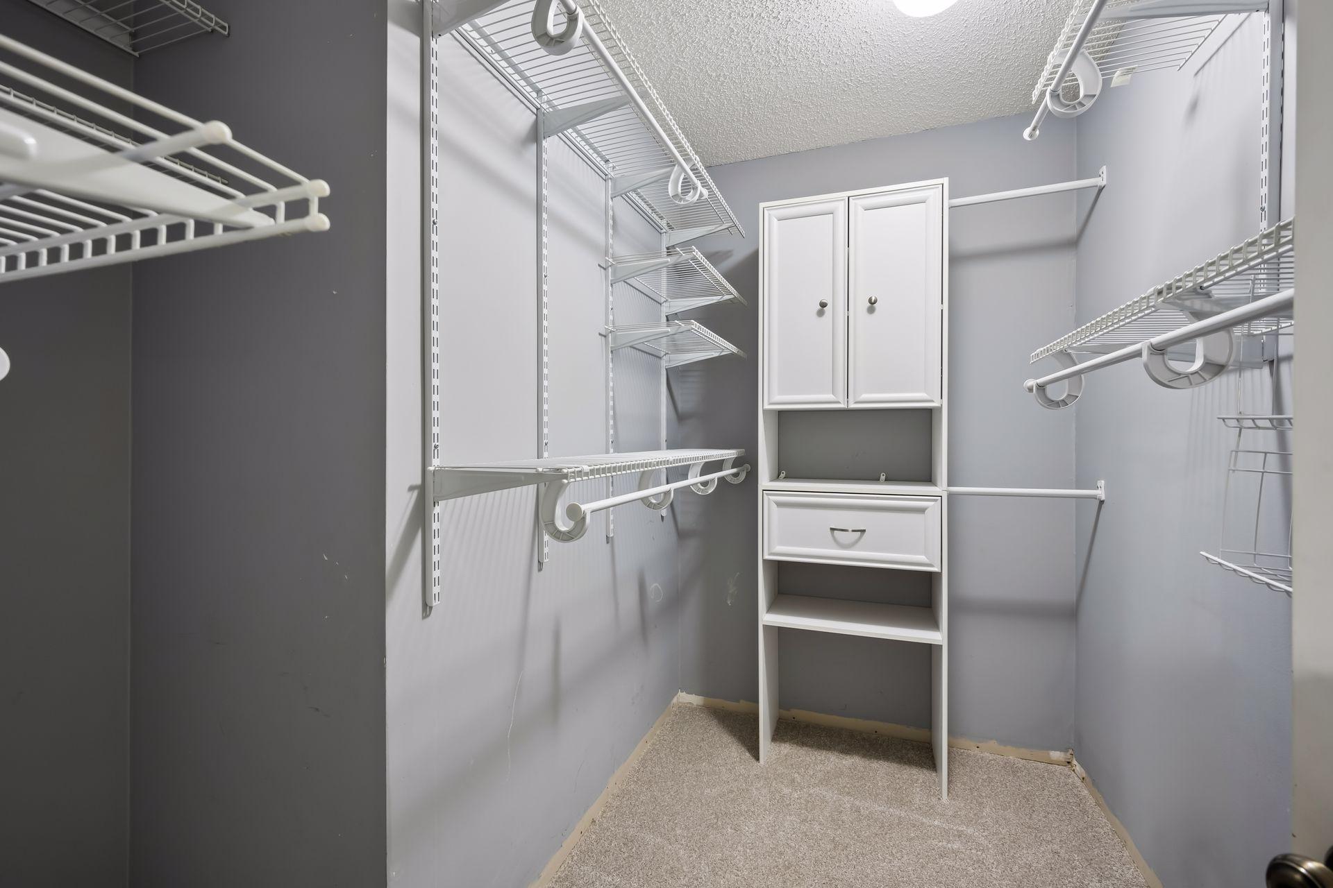 Primary bedroom walk in closet