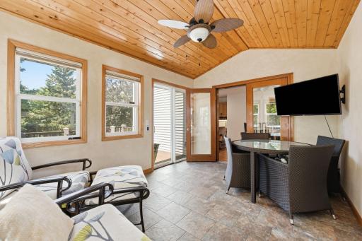 Amazing 3-season porch leads out to the Trex deck. Windows are newer, and line the interior of the room. Blinds that go up or down, too!