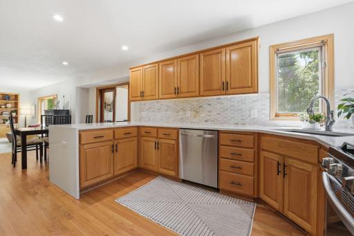 The kitchen flows directly into the informal dining area and 3 season porch.