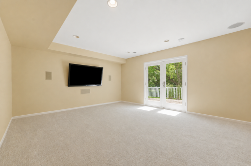 Walkout lower level family room. Brand new carpet throughout the lower level. Photo has been edited.
