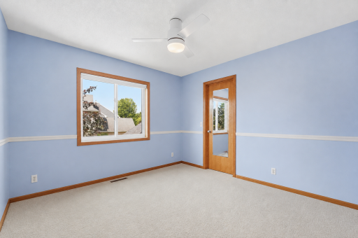 Upper-level bedroom 4 with a walk-in closet and a new window.