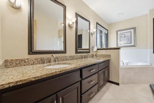 Private primary full bathroom with soaker tub and separate shower.