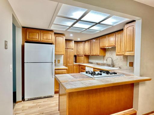 Great lighting in this kitchen and it has a ton of storage!