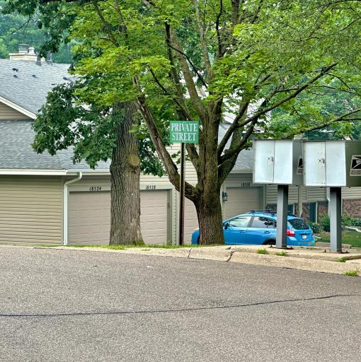 Your drive in leads to a round a bout like cul de sac but off the back is a private drive, take that turn and the unit will be ahead on your right. Access door is to the left of the garage doors. House numbers are on the garage doors.