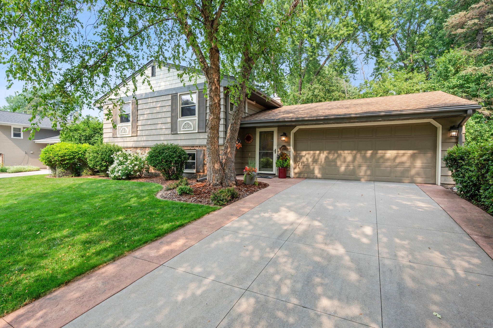 Beautiful home with attached 2 car garage, newer cement driveway, cedar & brick exterior
