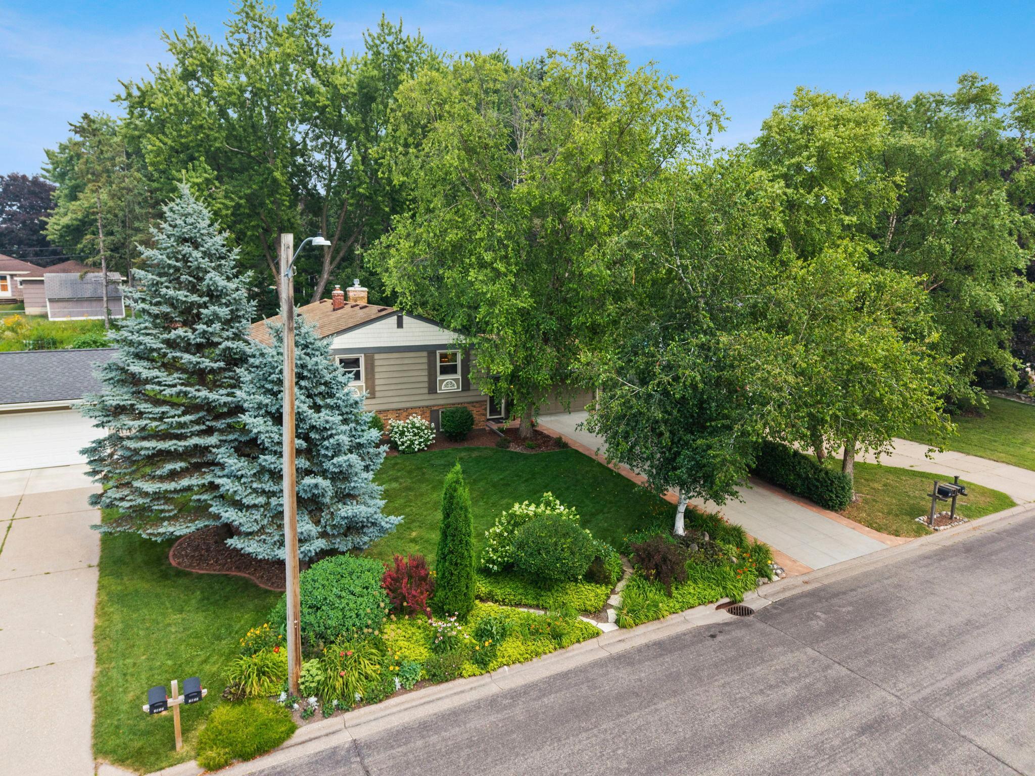 You will love the mature trees and gardens.