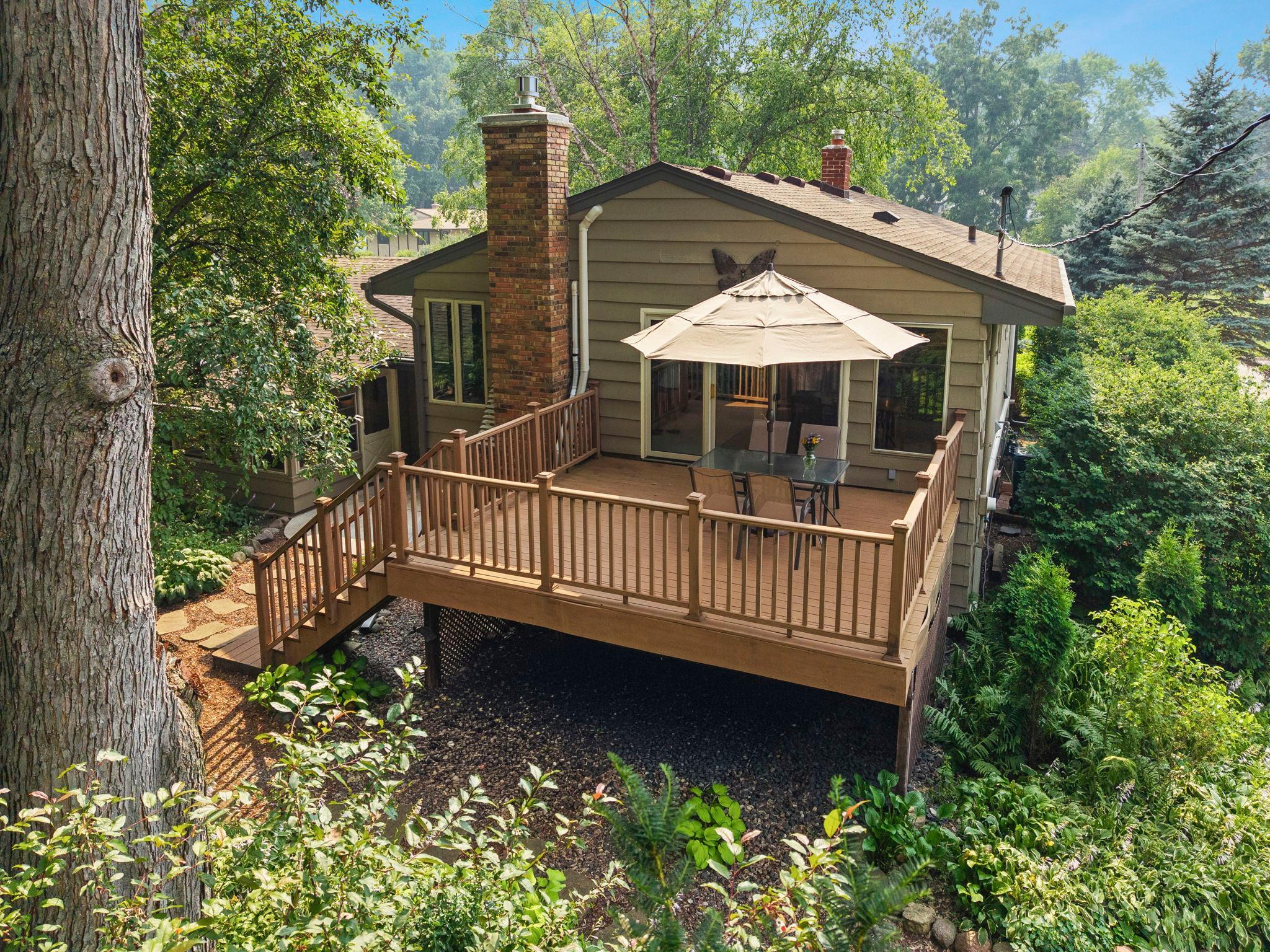 Large private deck with steps to backyard that is so private and peaceful