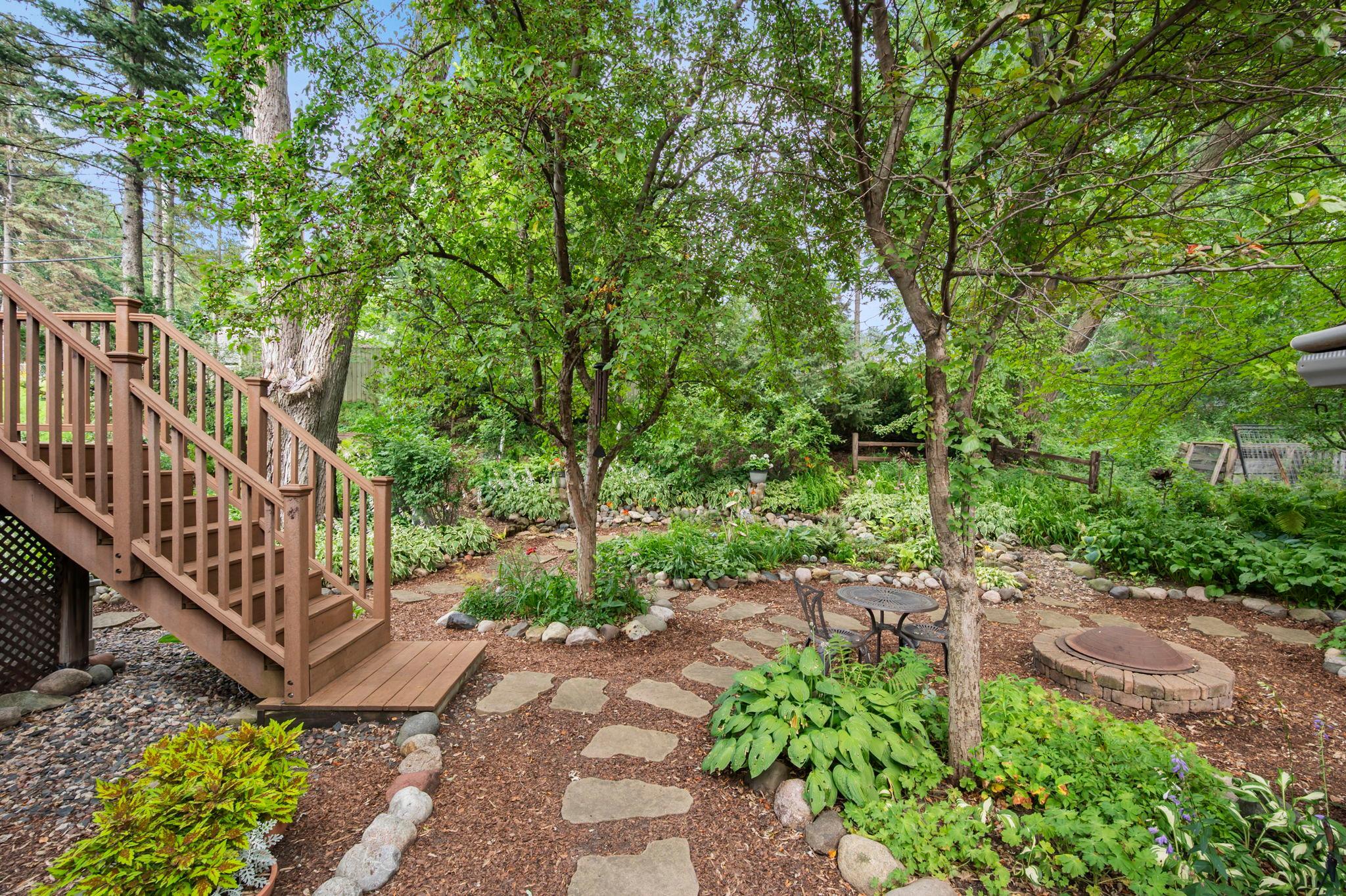 Enjoy your private retreat with large privacy fence in the back, beautiful gardens