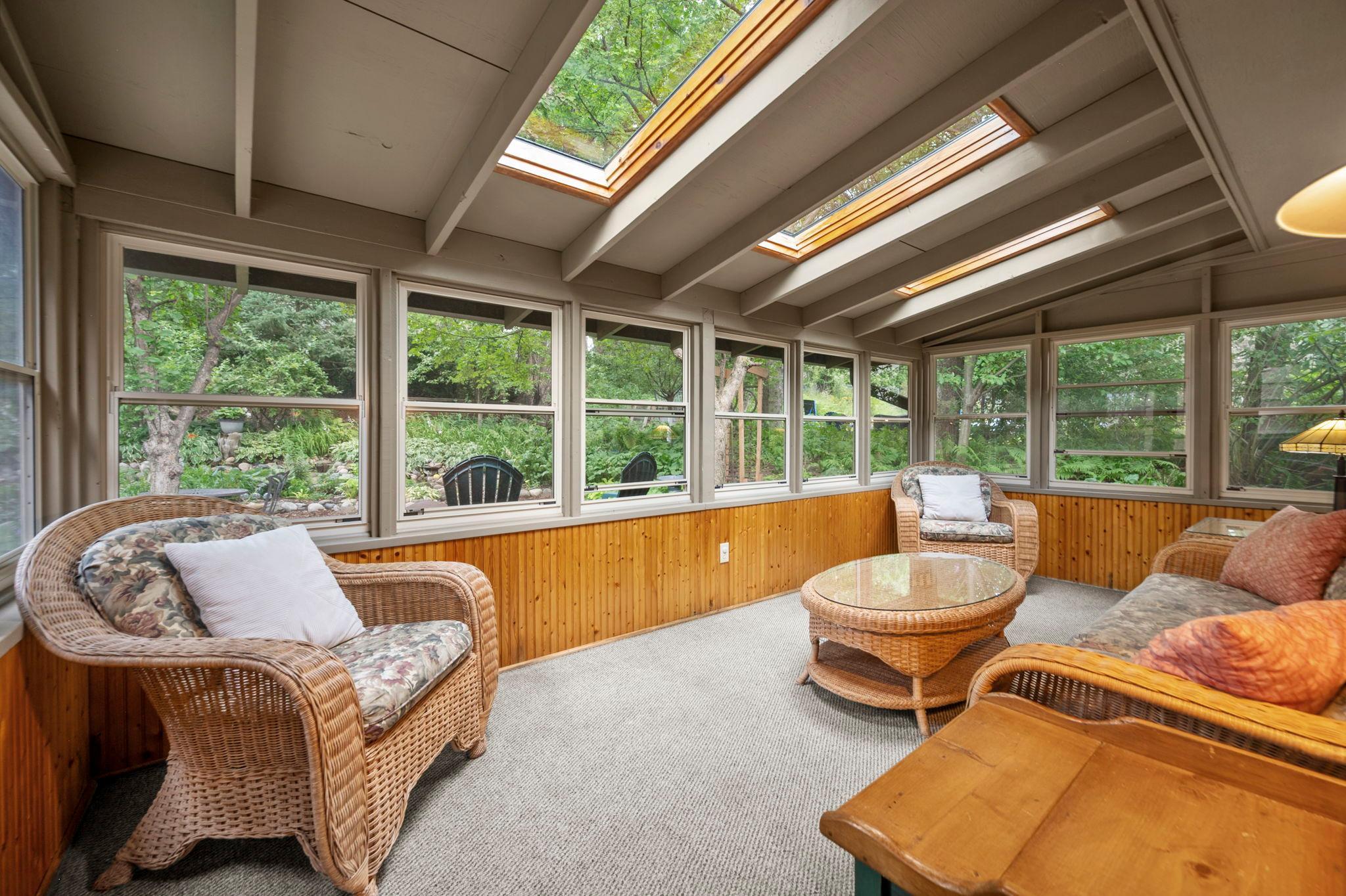 Beautiful 3 season porch overlooking backyard with 3 skylights
