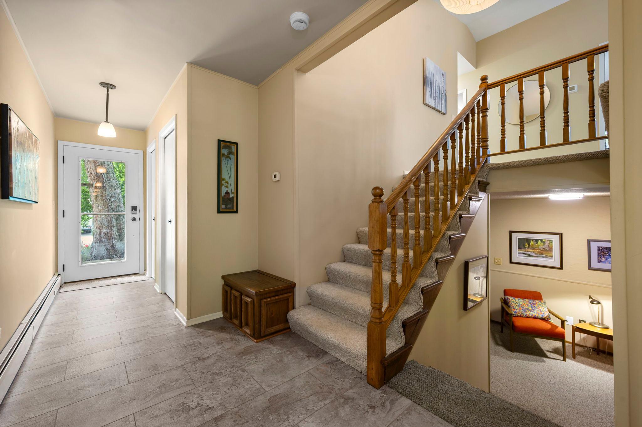 Large front entry foyer from front to back . Glass doors for great natural light.