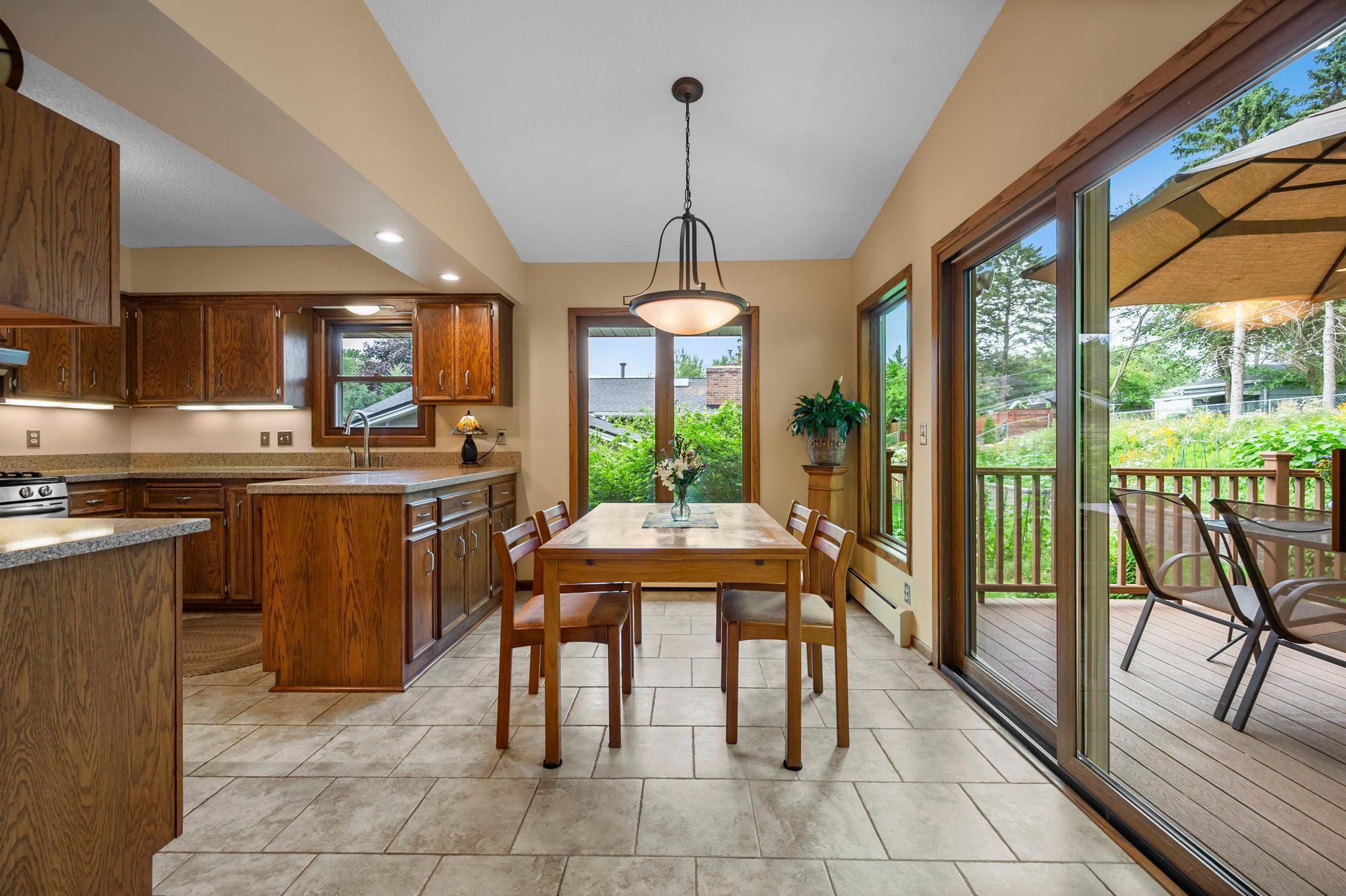 Open kitchen / dining room with great views to back deck and yard