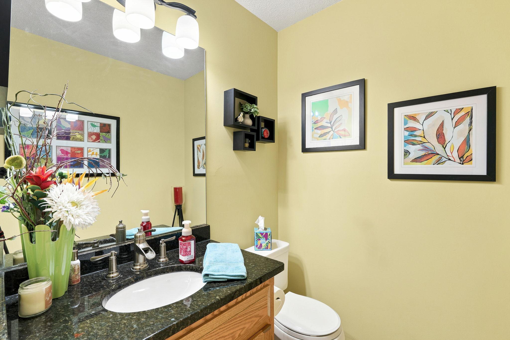 Main level 1/2 bath off of the kitchen and hallway.
