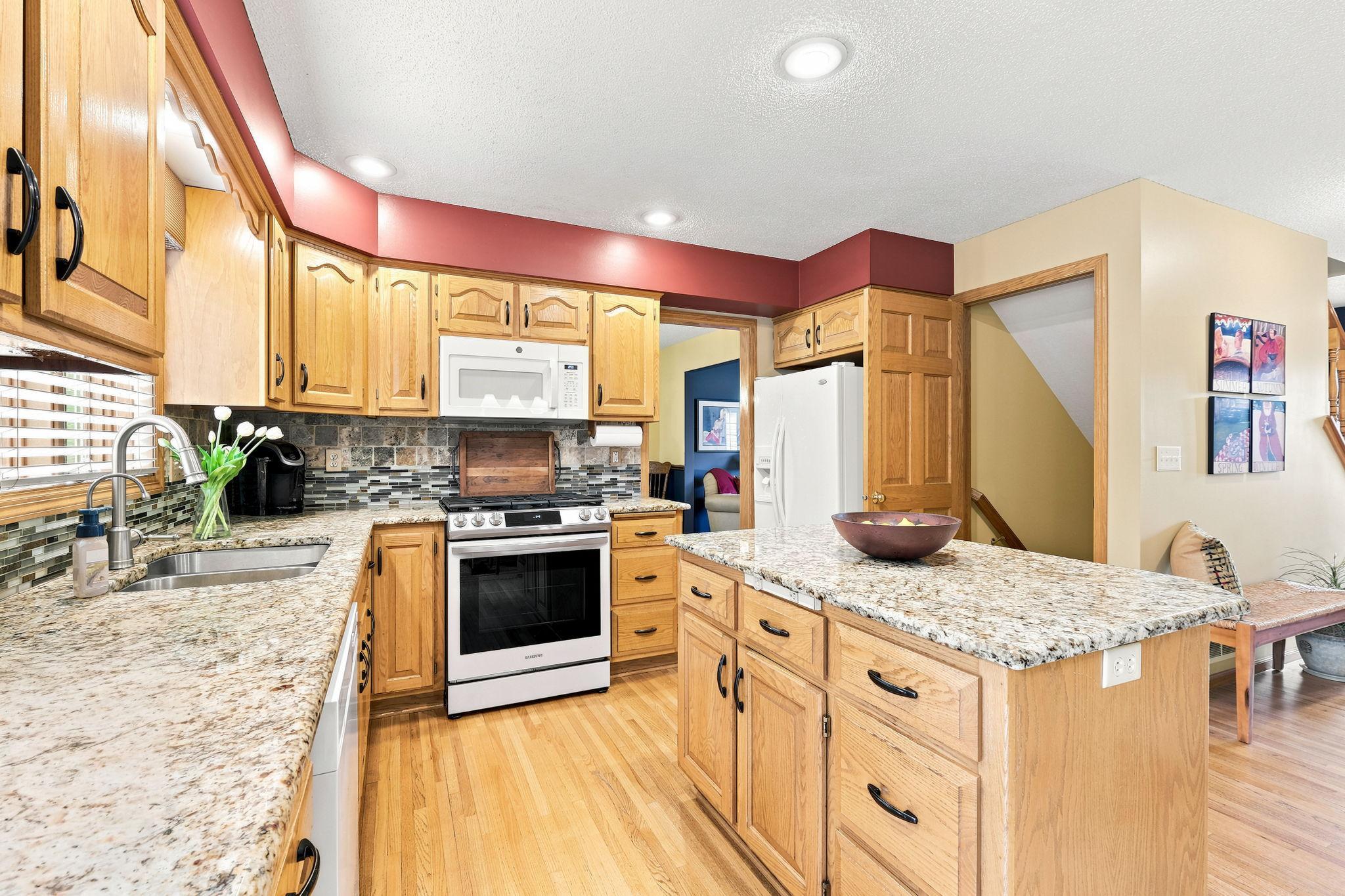 Gas stove and ample storage throughout the kitchen.