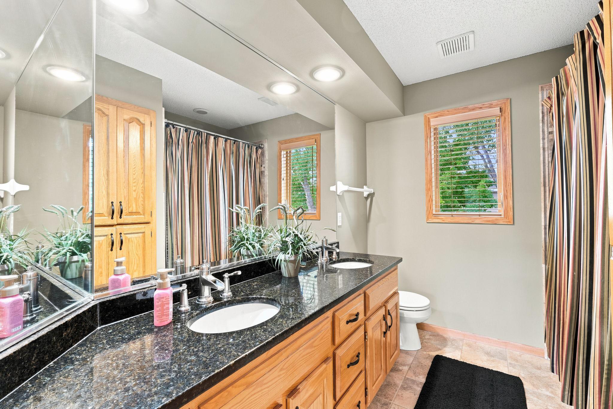 Granite counters, dual sinks, and jacuzzi tub.