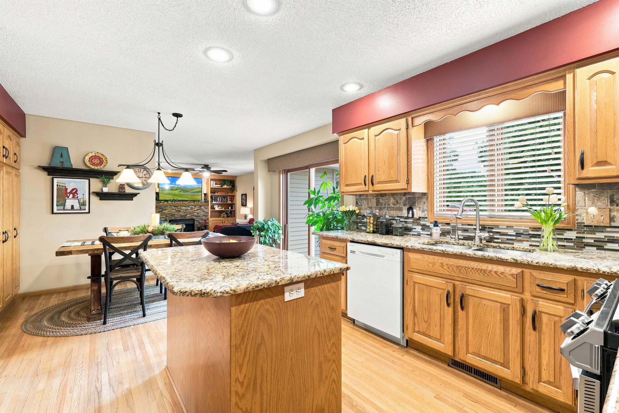 Kitchen window overlooks the back deck and large yard.
