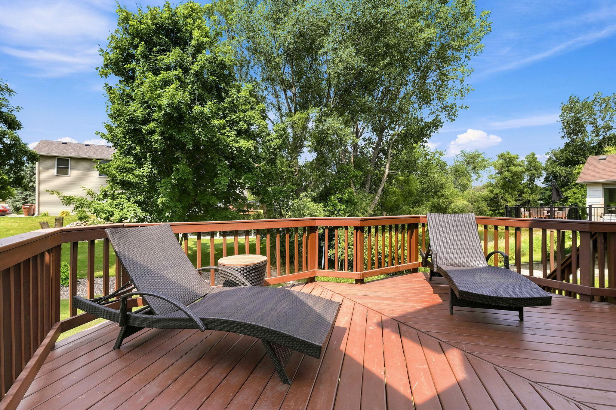Recently refinished back deck that has stairs down to the backyard.