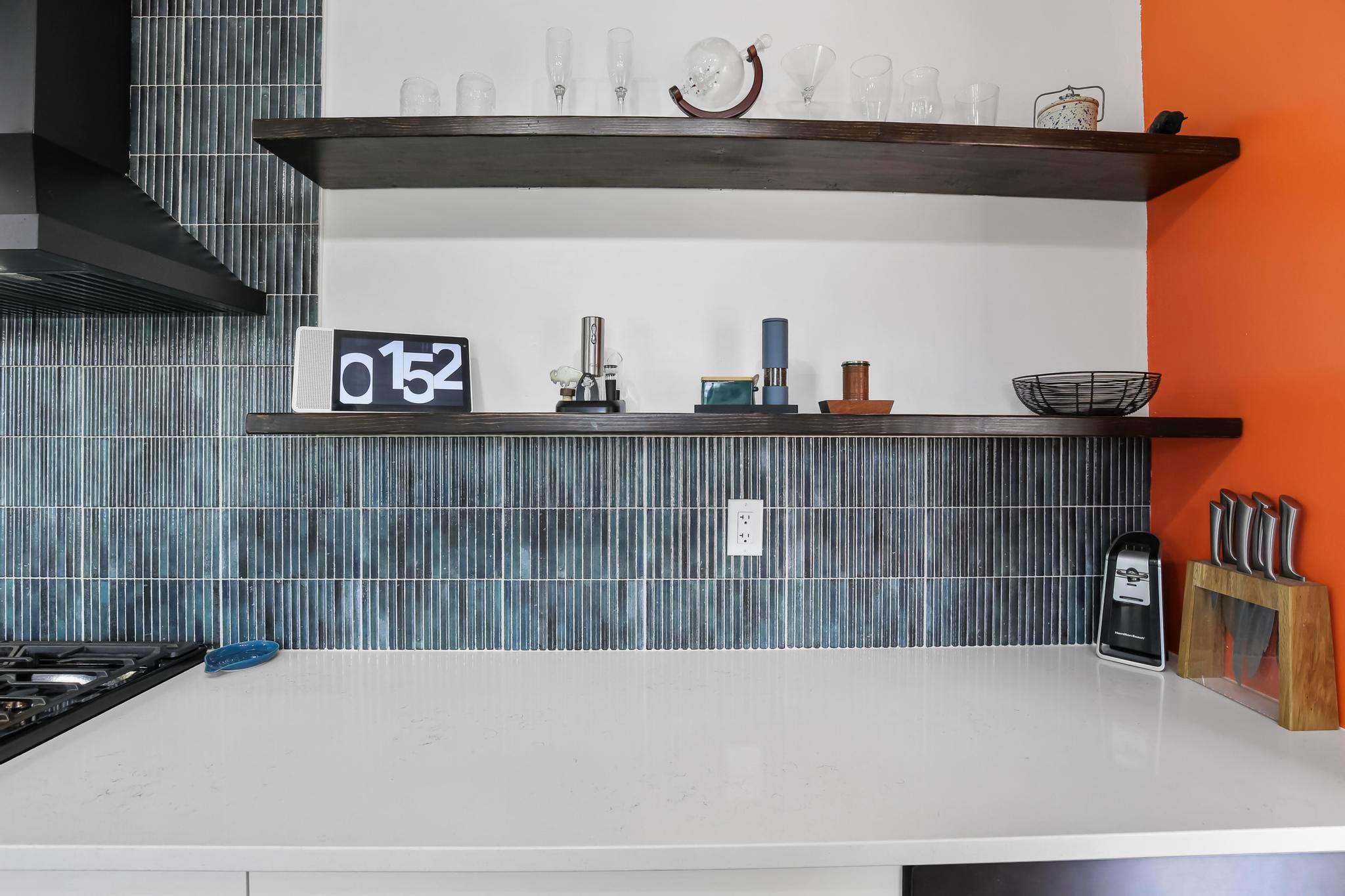 Beautiful backsplash and open floating shelves