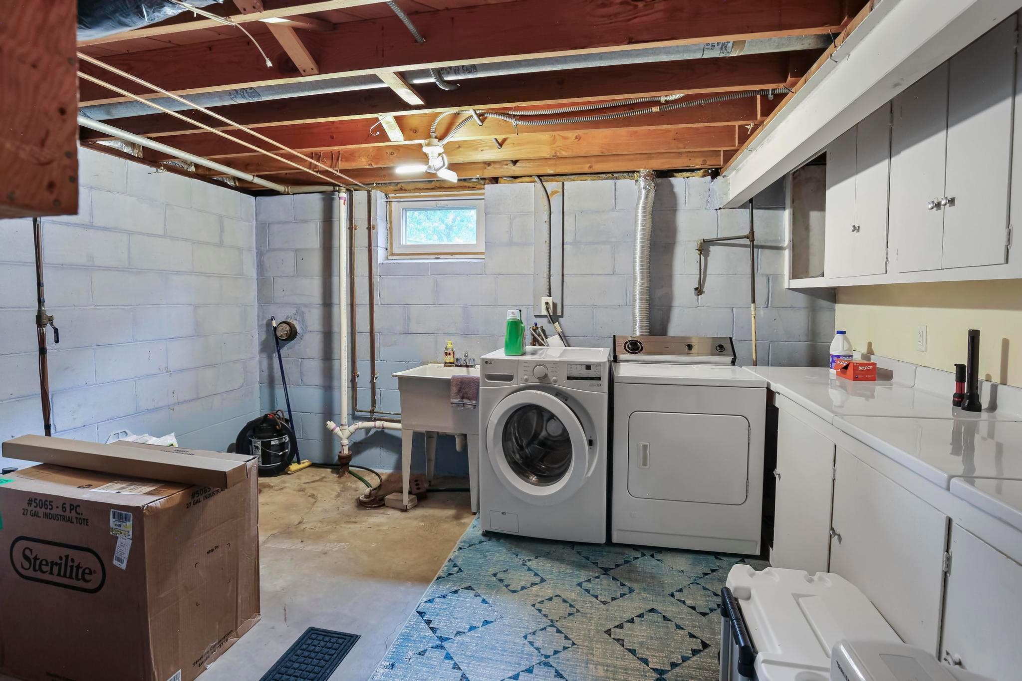 Laundry room with toilet