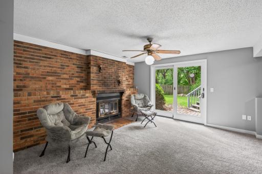 Walk out basement with cozy woodburning fireplace