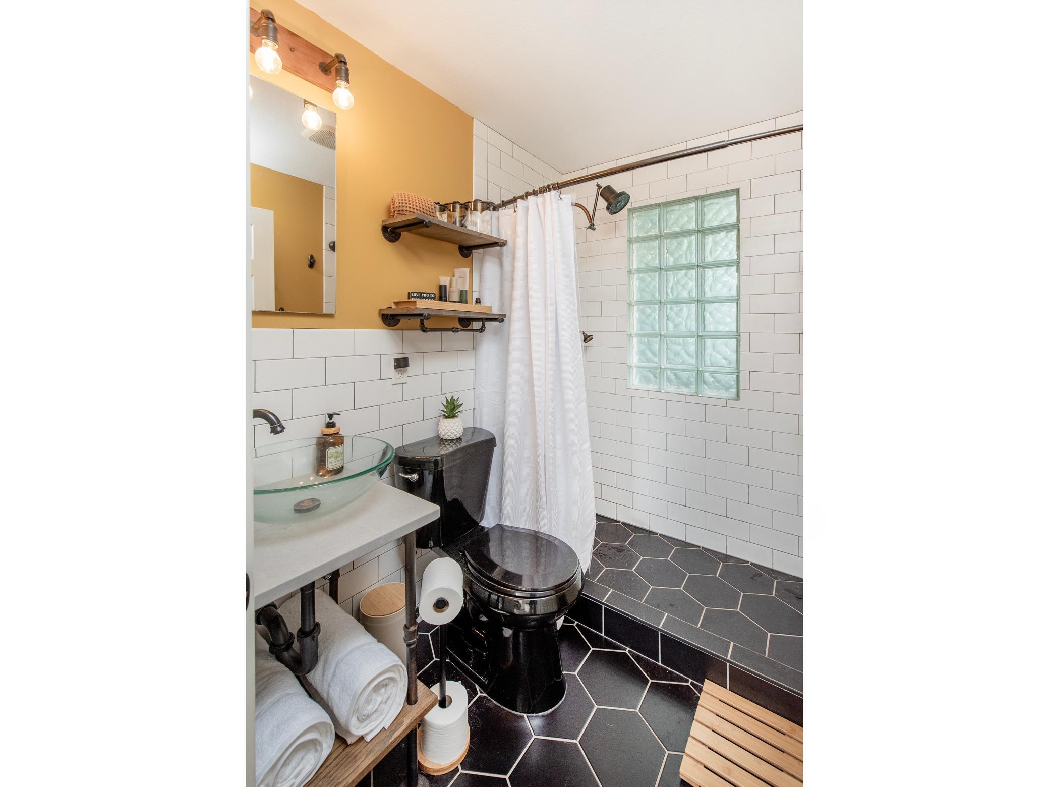 Custom tile, quartz counter, bluetooth exhaust fan