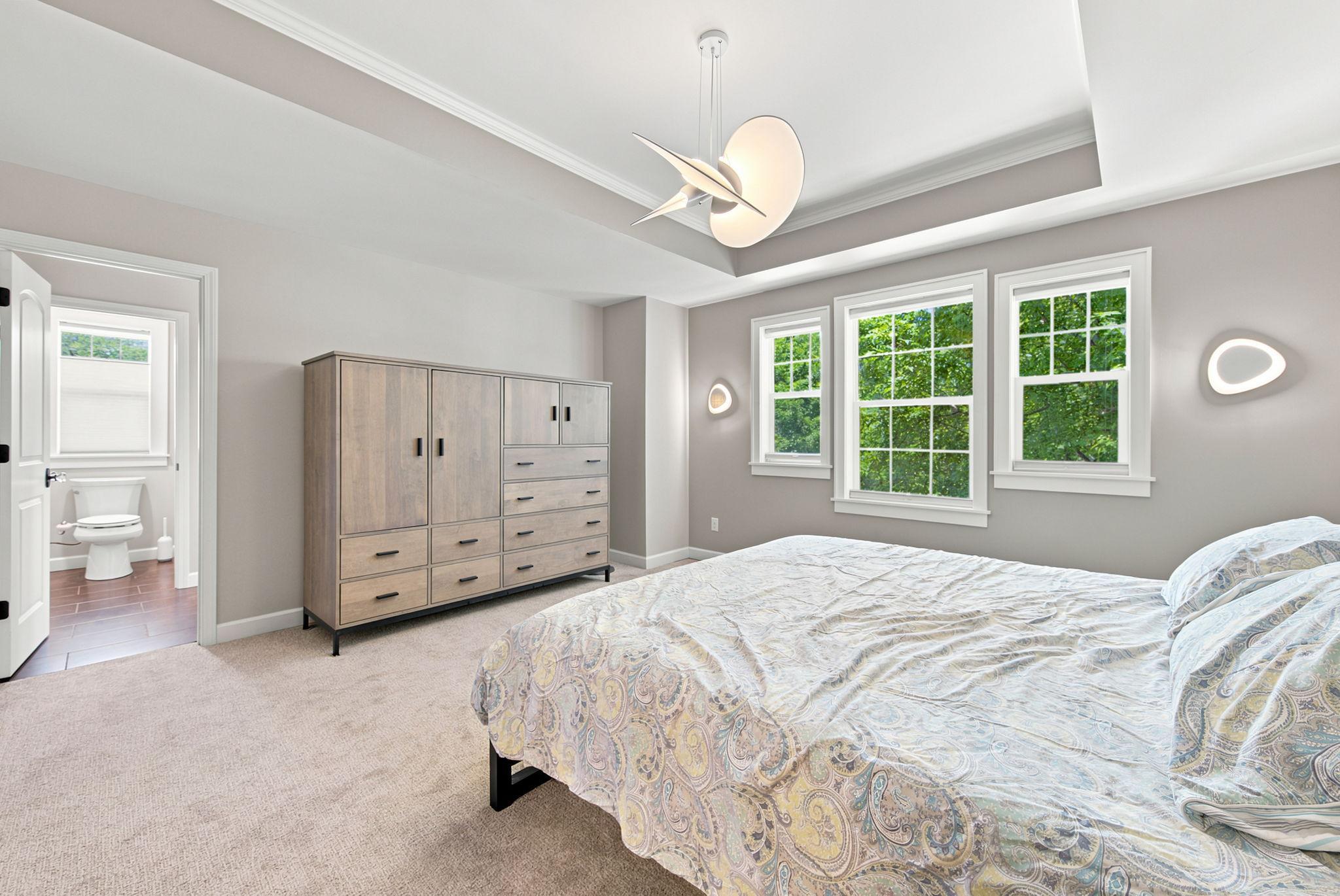 Beautiful Primary bedroom with Tray Ceilings
