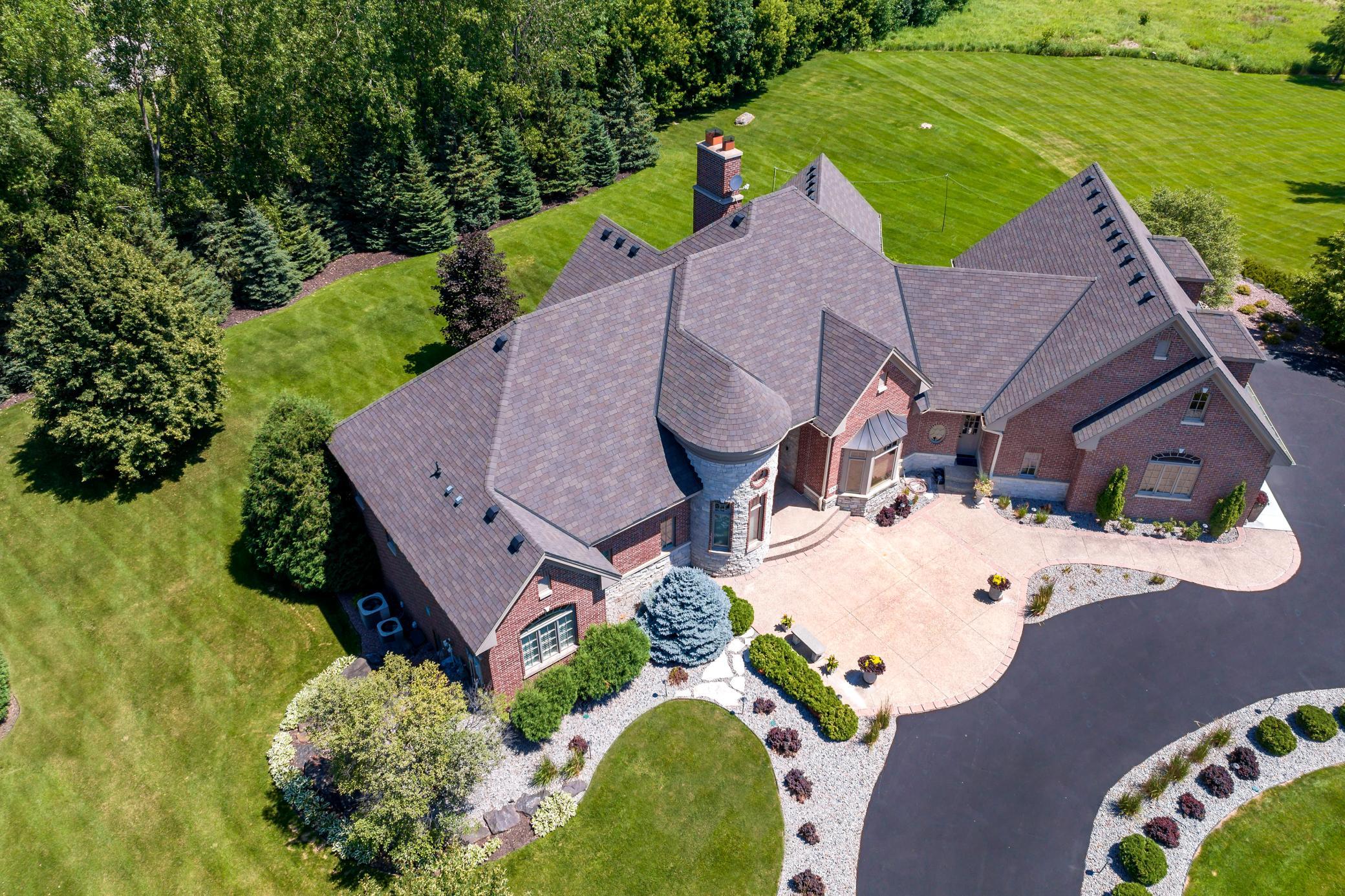 Nestled on 1.4 private acres, this custom-built executive home offers exceptional privacy, mature landscaping, and room to create your dream backyard.