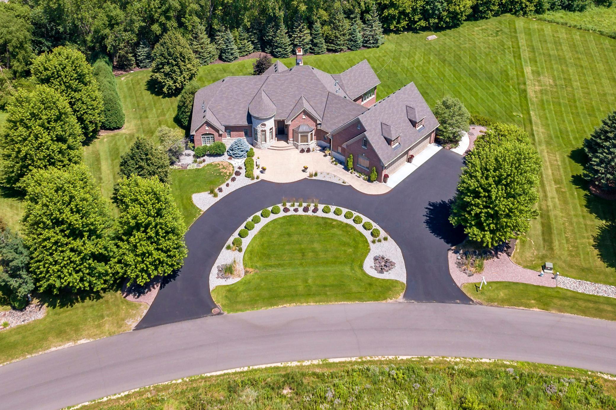 Custom-built executive rambler on 1.4 private acres in one of Medina's most sought-after luxury neighborhood Wild Meadows North.