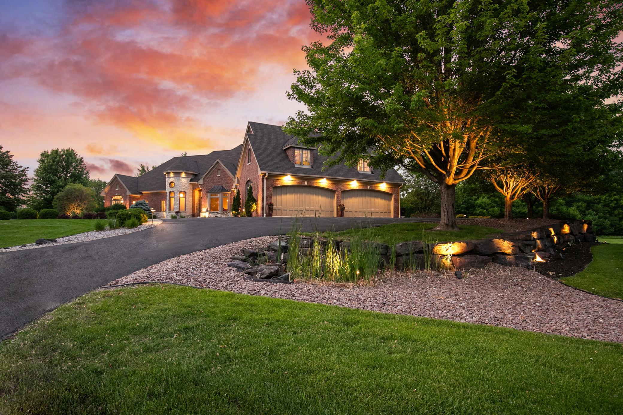 Designed for executive living, this custom-built estate blends timeless craftsmanship with exceptional privacy and expansive outdoor living.