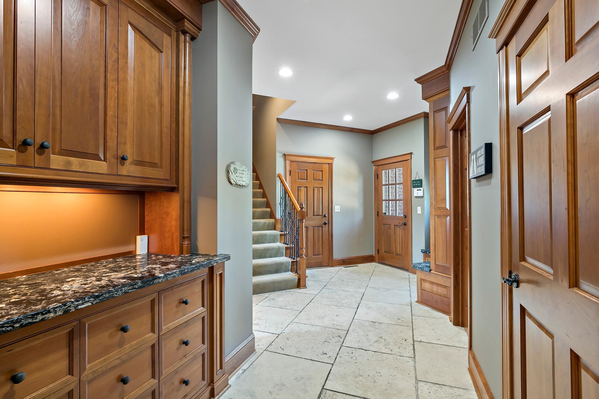 Private entrance offers direct access to the future elevator location and private living quarters—ideal for multigenerational living or aging parents.