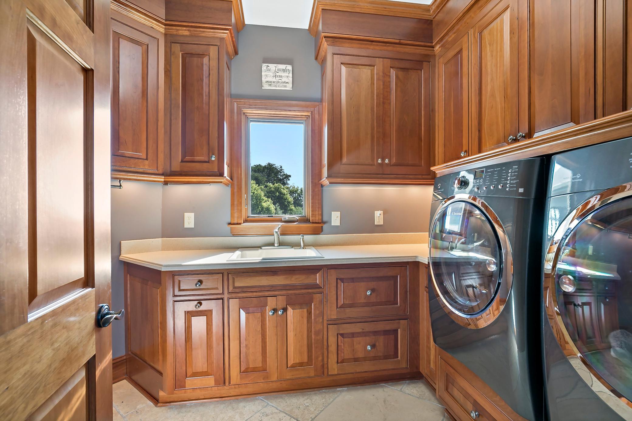 Main-floor laundry adds everyday convenience to this true one-level luxury home.. Additional 2nd laundry in basement.