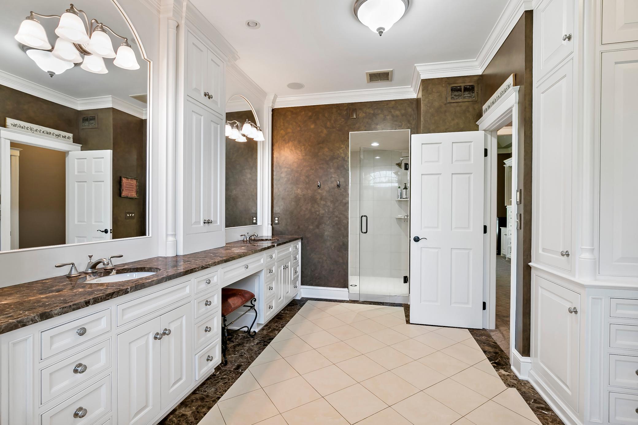 Luxury primary bath designed for everyday comfort, complementing the convenience of true main-floor living.