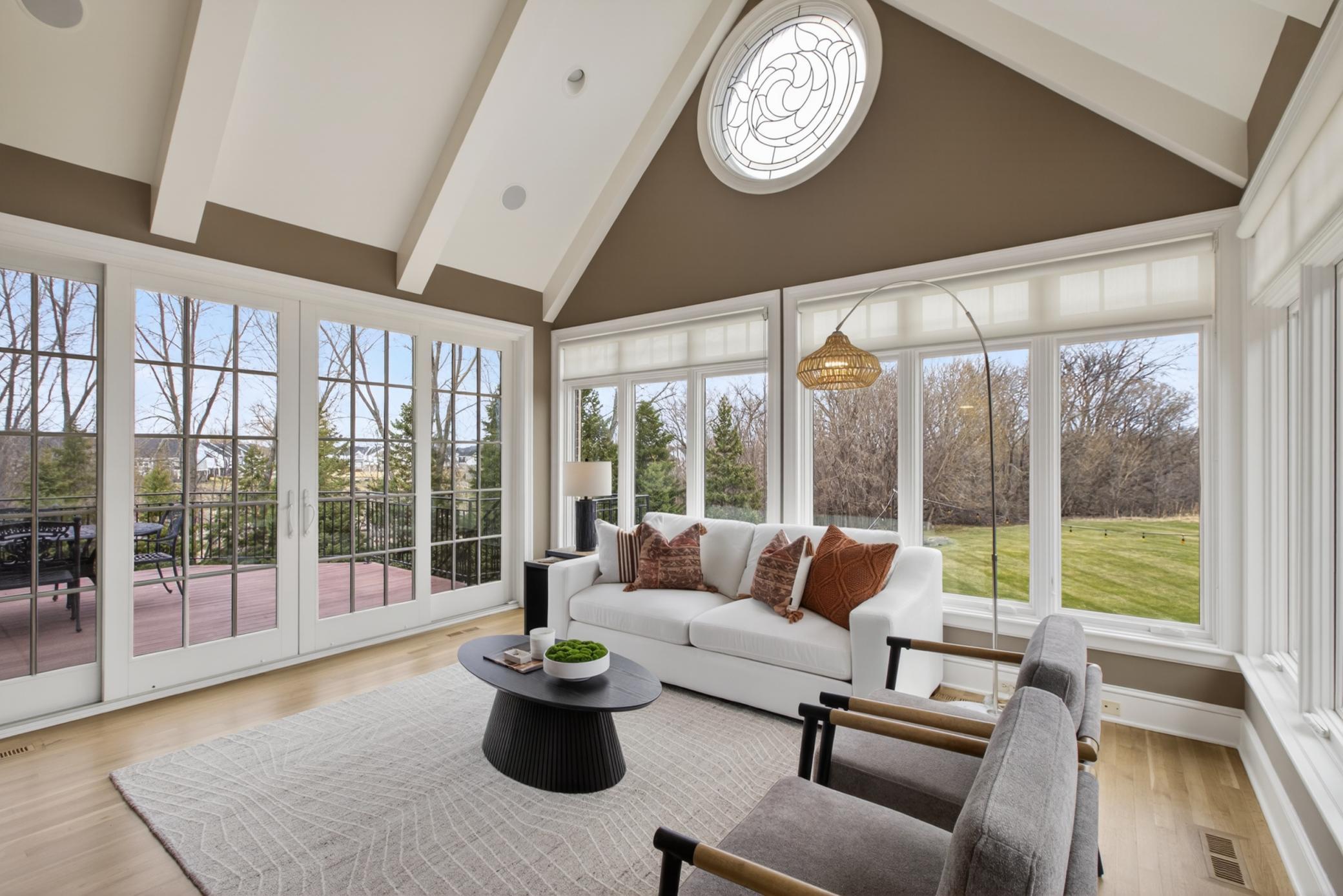 Relax year-round in the sunroom surround by windows overlooking mature trees, abundant wildlife, and your private 1.4-acre retreat.