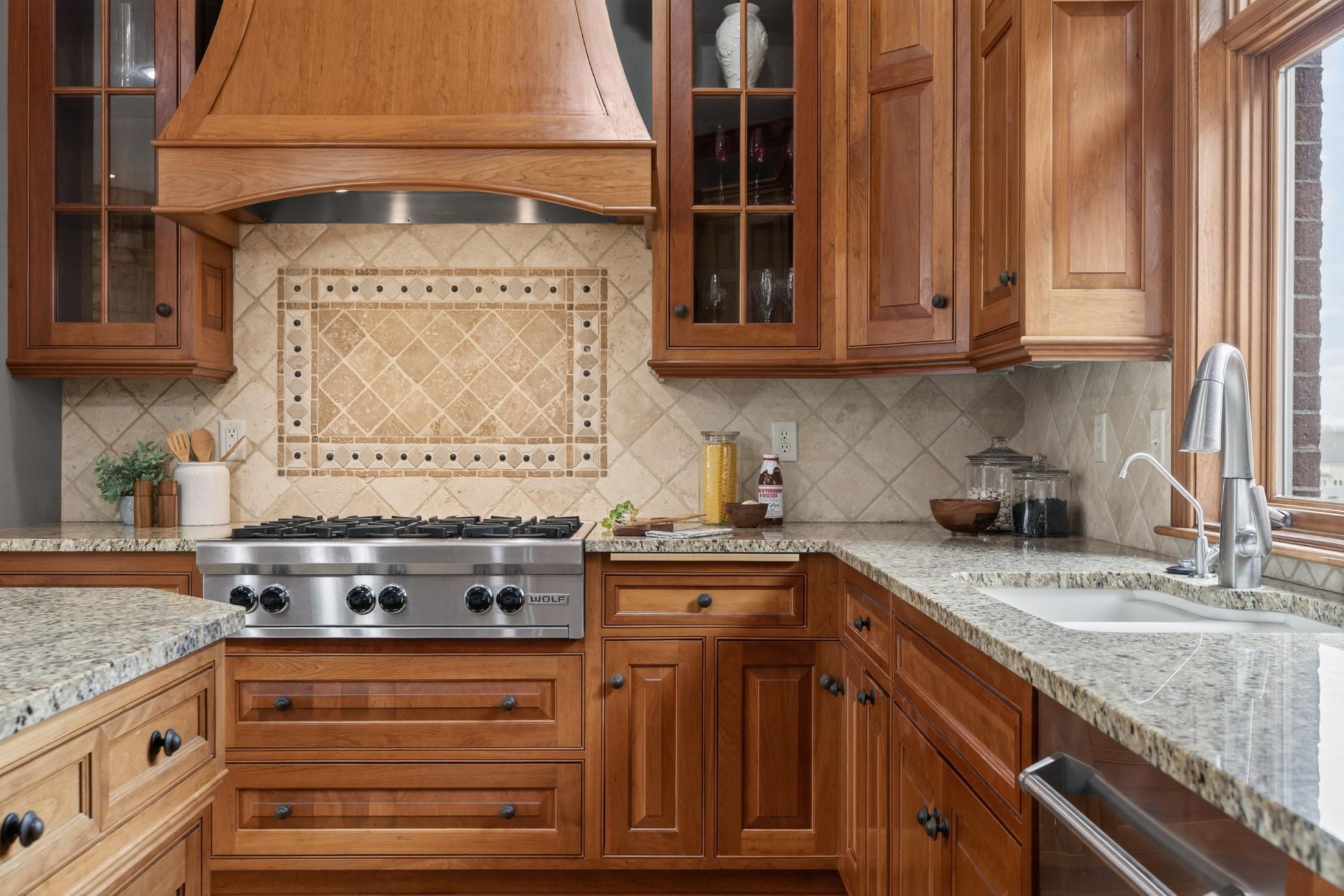 Luxury buyers will appreciate the handcrafted cherry cabinetry, generous workspace, and open-concept design. Wolf and Subzero appliances.