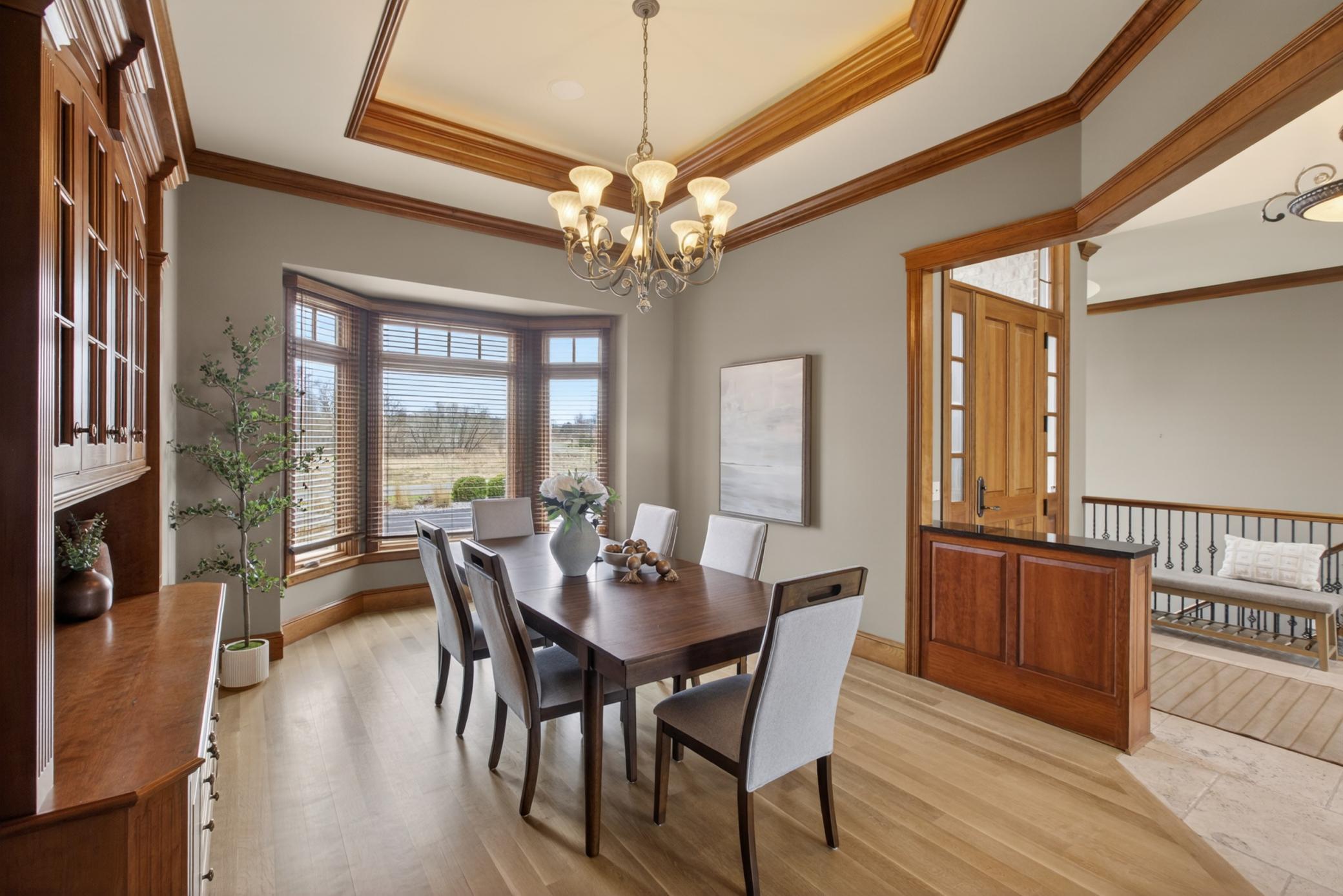Beautifully appointed formal dining room complements the open layout while creating a welcoming space for special occasions.